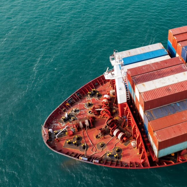 cargo ship carrying container - customs clearance - Waller Transport Services